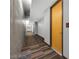 Hallway with door in a modern designed interior with concrete accents at 353 E Bonneville Ave # 183/283, Las Vegas, NV 89101