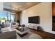Bright living room featuring stylish furniture, a sleek TV console, and an open layout for modern living at 353 E Bonneville Ave # 183/283, Las Vegas, NV 89101