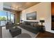 Sophisticated living room with ample seating, modern decor, and an adjacent balcony with scenic views at 353 E Bonneville Ave # 183/283, Las Vegas, NV 89101