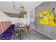 Modern office space features a stylish table, colorful seating, and unique lighting fixtures at 353 E Bonneville Ave # 183/283, Las Vegas, NV 89101