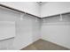 Spacious, walk-in closet with ample storage space and carpet flooring at 353 E Bonneville Ave # 183/283, Las Vegas, NV 89101