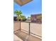 Cozy balcony with city views, palm trees, and modern railing at 353 E Bonneville Ave # 375, Las Vegas, NV 89101