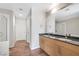 A spacious bathroom features double sinks, granite countertops, and a glass door shower at 353 E Bonneville Ave # 375, Las Vegas, NV 89101