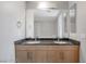 A spacious bathroom features double sinks, granite countertops, and a glass door shower at 353 E Bonneville Ave # 375, Las Vegas, NV 89101