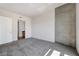 Bedroom with an attached bathroom features neutral carpet and natural light at 353 E Bonneville Ave # 375, Las Vegas, NV 89101