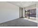 A bright bedroom features a large window with city views and neutral carpet at 353 E Bonneville Ave # 375, Las Vegas, NV 89101