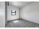 Bright bedroom featuring neutral carpeting, a window providing natural light, and minimalist decor at 353 E Bonneville Ave # 375, Las Vegas, NV 89101