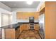 Modern kitchen featuring sleek black countertops, stainless steel appliances, and plenty of cabinet space at 353 E Bonneville Ave # 375, Las Vegas, NV 89101