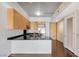 Modern kitchen featuring granite countertops and stainless steel appliances with dark hardwood floors at 353 E Bonneville Ave # 375, Las Vegas, NV 89101