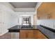 This modern kitchen boasts an island with a black countertop and stainless steel appliances at 353 E Bonneville Ave # 375, Las Vegas, NV 89101