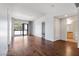 Spacious living room features hardwood floors and access to a balcony with views of palm trees at 353 E Bonneville Ave # 375, Las Vegas, NV 89101