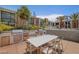 Outdoor kitchen with grills and seating, perfect for entertaining guests at 353 E Bonneville Ave # 375, Las Vegas, NV 89101