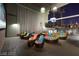 Outdoor lounge space with cushioned seating, stylish decor, and ambient lighting at 353 E Bonneville Ave # 515, Las Vegas, NV 89101