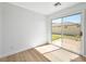 Bright bedroom with a sliding glass door leading to a brick patio and outdoor area at 4016 Balsam Mountain St, Las Vegas, NV 89129