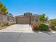 Charming single-story home with a two-car garage and desert landscaping for low maintenance at 4016 Balsam Mountain St, Las Vegas, NV 89129