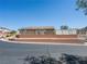 Exterior view of a single story home on a terraced corner lot with desert landscaping at 4016 Balsam Mountain St, Las Vegas, NV 89129