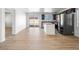 Open-concept kitchen showcasing stainless steel appliances, brown cabinets, and an island at 4016 Balsam Mountain St, Las Vegas, NV 89129