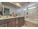 Elegant bathroom featuring double sinks, modern fixtures, and a glass-enclosed shower at 4278 Lemay St # 2, Las Vegas, NV 89115