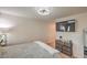 Serene bedroom featuring carpeted flooring, natural light, and a mounted TV at 4278 Lemay St # 2, Las Vegas, NV 89115