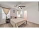 Bright bedroom featuring a ceiling fan, carpet flooring, and ensuite bathroom access at 4278 Lemay St # 2, Las Vegas, NV 89115
