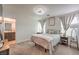 Comfortable bedroom with large windows, a ceiling fan, and carpeted flooring at 4278 Lemay St # 2, Las Vegas, NV 89115
