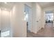 Neutral hallway with carpeted floors and white walls leading to bedrooms at 4278 Lemay St # 2, Las Vegas, NV 89115