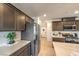 Stylish kitchen featuring dark wood cabinets, stainless steel appliances, and bright countertops at 4278 Lemay St # 2, Las Vegas, NV 89115