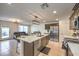 Open-concept living space with kitchen island, tile flooring, and modern furnishings at 4278 Lemay St # 2, Las Vegas, NV 89115