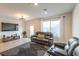 Spacious living room featuring tile flooring, large windows, and a comfortable sofa set at 4278 Lemay St # 2, Las Vegas, NV 89115
