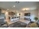 Open-concept kitchen and living room featuring a kitchen island with seating and modern appliances at 4278 Lemay St # 2, Las Vegas, NV 89115