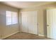 Bright bedroom with closet and window showing a well-lit living space at 4370 Sandy River Dr # 24, Las Vegas, NV 89103