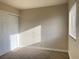 Neutral bedroom features carpet and a large closet with a window to let light in at 4370 Sandy River Dr # 24, Las Vegas, NV 89103