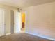 Standard bedroom with carpet, standard closet, and entry to a bathroom at 4370 Sandy River Dr # 24, Las Vegas, NV 89103