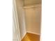 Small walk in closet featuring wood floors and a hanging rod at 4370 Sandy River Dr # 24, Las Vegas, NV 89103