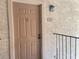 Close-up of the entry door, showing the unit number and traditional door hardware at 4370 Sandy River Dr # 24, Las Vegas, NV 89103