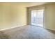 Living room with a sliding glass door to the balcony, offering abundant natural light at 4370 Sandy River Dr # 24, Las Vegas, NV 89103