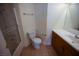 Bathroom featuring a tub and shower, toilet, and vanity with storage space in cabinets at 5200 Brookmere Dr, Las Vegas, NV 89130