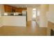 Open living area with tile flooring, a breakfast bar, fireplace and access to the kitchen at 5200 Brookmere Dr, Las Vegas, NV 89130