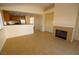 Spacious living area featuring tile flooring, a fireplace, open layout and neutral decor at 5200 Brookmere Dr, Las Vegas, NV 89130