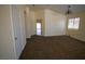 Bright living room with neutral walls and carpets, archway entrance and ample natural light at 5200 Brookmere Dr, Las Vegas, NV 89130