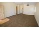 Spacious living room with neutral carpet, high ceilings, and lots of natural light at 5200 Brookmere Dr, Las Vegas, NV 89130