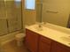 Well-lit bathroom featuring a double sink vanity, shower over tub, and modern fixtures at 5481 Railroad River Ave, Las Vegas, NV 89139