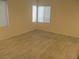 Clean, bright bedroom with ample natural light shining through the windows at 5481 Railroad River Ave, Las Vegas, NV 89139