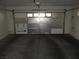Spacious garage showing the insulated garage door facing inward at 5481 Railroad River Ave, Las Vegas, NV 89139