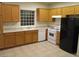 Bright kitchen features light wood cabinets, white appliances and ample counter space at 5481 Railroad River Ave, Las Vegas, NV 89139