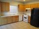 Functional kitchen featuring bright cabinets, a gas range, and modern appliances at 5481 Railroad River Ave, Las Vegas, NV 89139