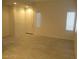 Open living room with light wood floors and windows provides ample natural light at 5481 Railroad River Ave, Las Vegas, NV 89139