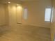 Bright, open-concept living area showcasing tile flooring and abundant natural light at 5481 Railroad River Ave, Las Vegas, NV 89139
