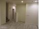 Spacious living room shows neutral walls and floors along with baseboard trim at 5481 Railroad River Ave, Las Vegas, NV 89139