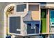 Aerial view of home with solar panels, putting green and rooftop deck at 5946 Ancient Peaks Ave, Las Vegas, NV 89141